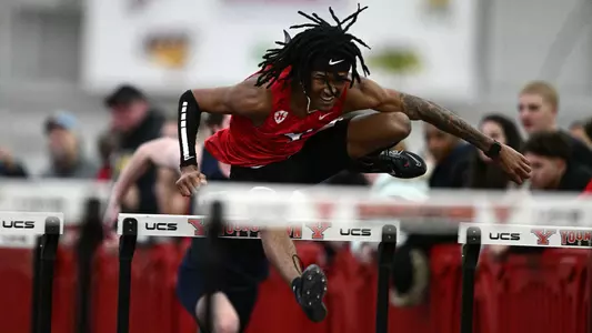 Micah Mitchell clears a hurdle
