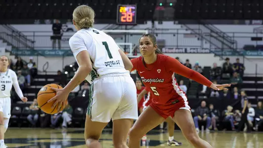 Hayden Barrier defends a Green Bay player in the Penguins' game at the Kress Center on Dec. 7, 2025. Photo by Chloe Whitlock