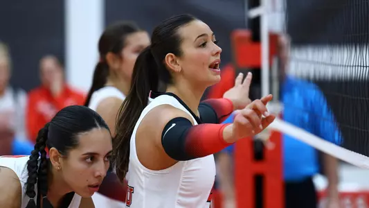 Bianca Giglio and Gabriela Machin at the net in YSU's volleyball match vs. Duquesne on Aug. 29, 2025.