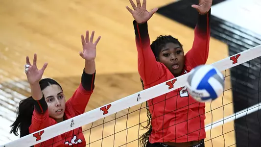 Gabriela Machin and Niyah Lester go up for a block as YSU's volleyball team played Canisius on Aug. 30, 2025.