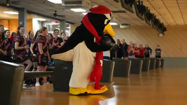Pete the Penguin prepares to bowl to open the 2025 Chelsea Gilliam Penguin Classic at Holiday Bowl.