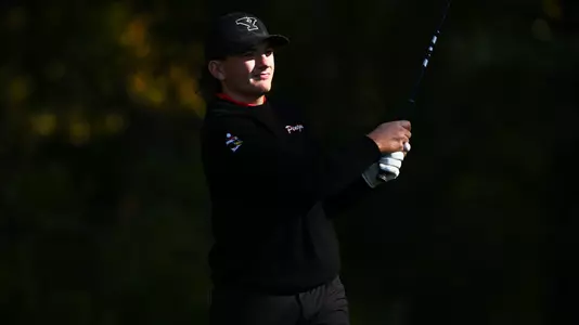 Nolan Shilling watches a tee shot for YSU during the Tom Tontimonia Invitational on Oct. 6, 2026 (Photo by Robert Hayes)