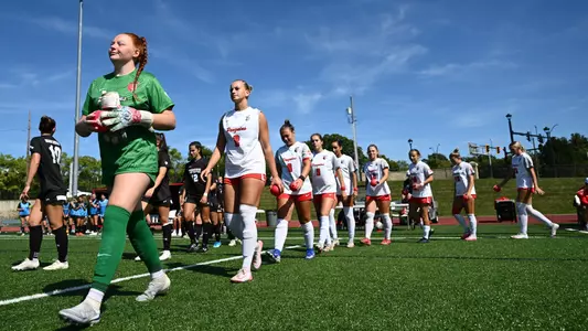 Women's Soccer team's starting lineup walks out the the field
