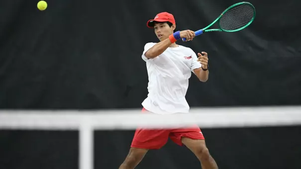 Phopthum Sriwong returns a forehead tennis shot
