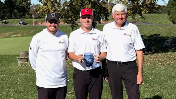 YSU's Ryan Sam poses for a photo with Head Coach Tony Joy and Assistant Coach Brian Terlesky following his win at the Xavier Invitational on Oct. 20, 2026 (Photo by Xavier Athletics)