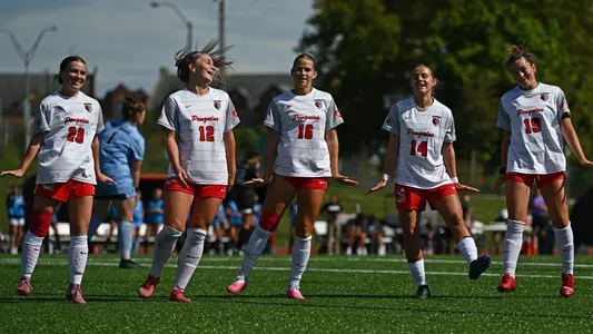 YSU Soccer Players celebrate after scoring a goal