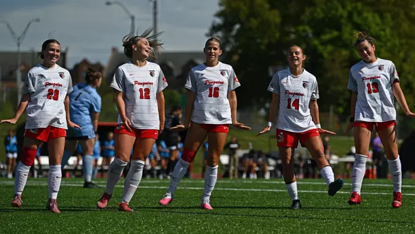 YSU Soccer Players celebrate after scoring a goal