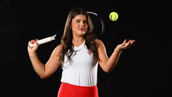 Duru Kuscu tosses a tennis ball during the team's annual media day