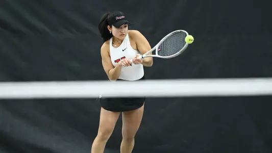 Lorena Cedeno returns a forehand tennis shot