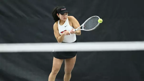 Lorena Cedeno returns a forehand tennis shot