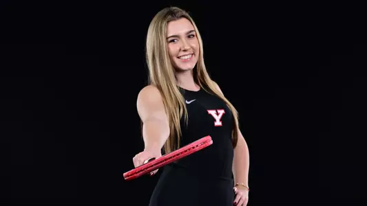 Lydia Foster poses with a tennis racquet