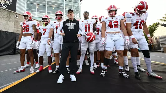 Doug Phillips and the YSU football team await to enter the field at Towson.