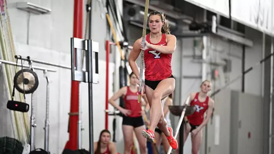 Ainsley Hamsher runs down the runway during the pole vault