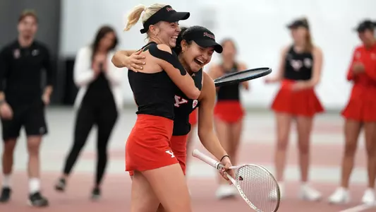 Line Greyling and Lorena Cedeno hug after winning the doubles point