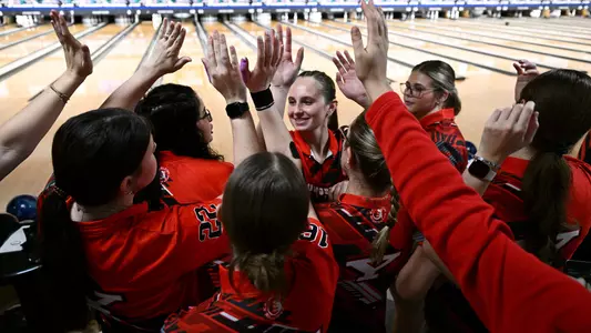 Amy Chrzanowski high-fives her teammates at the 2025 Chelsea Gilliam Penguin Classic on Oct. 17, 2025. Photo by Robert Hayes.