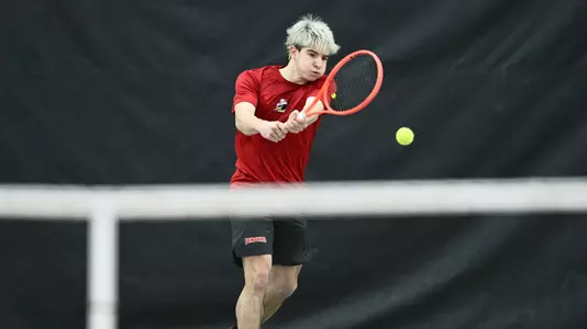 Matteo Ceradelli returns a serve