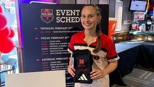Amy Chrzanowski stands with her all-tournament team award at the 2026 Big Red Invitational
