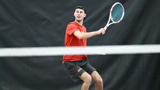 Rafael Le Fur swings a tennis racquet