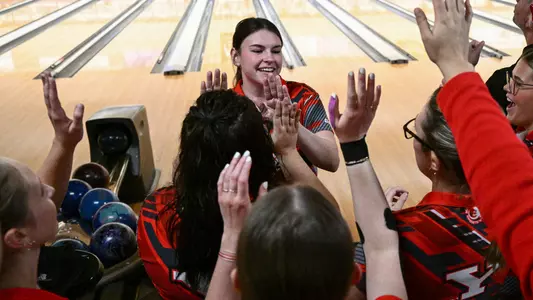 Kara Beissel high-fives her Youngstown State bowling teammates at the 2025 Chelsea Gilliam Penguin Classic on Oct. 17, 2025. Photo by Robert Hayes.