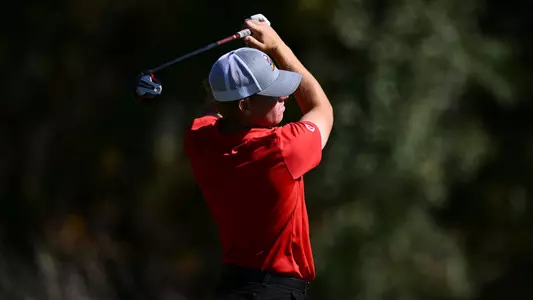 Ryan Sam follows through in his golf swing