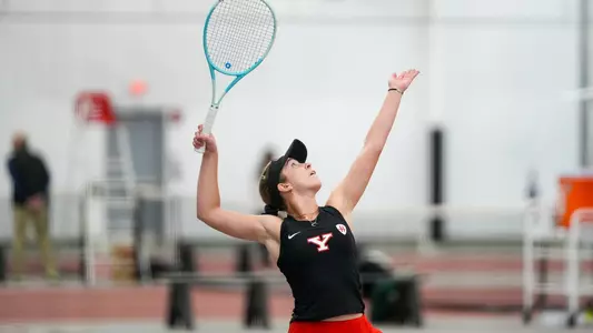 Hanna Telzynska serves a tennis ball
