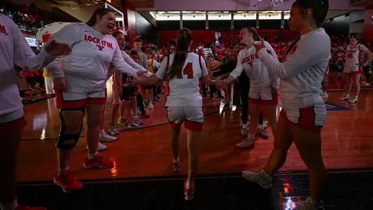 Casey Santoro high fives teammates during starting introductions before Youngstown State women's basketball game vs. Maryland Eastern Shore in the second round of the 2026 Postseason WNIT.