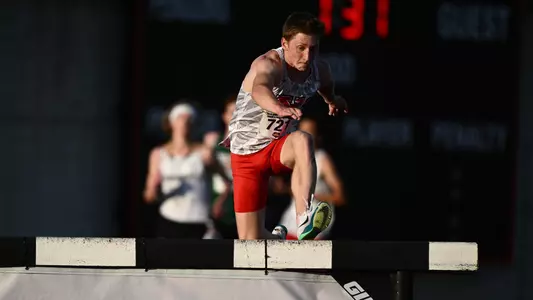 Sage Vavro jumps a barrier during the steeplechase