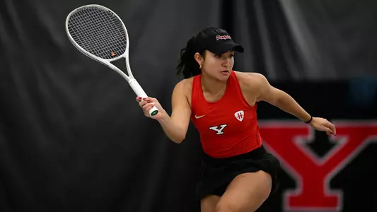 Lorena Cedeno prepares her racquet to return a tennis shot