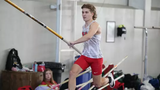 Lukas Lang runs down the pole vault runway