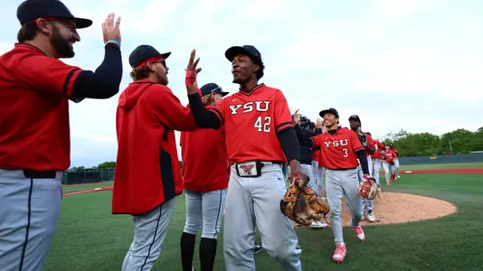 Kendal Spencer and YSU teammates celebrate a victory at Wright State on May 15, 2026 (Photo by Bryson Chavez)