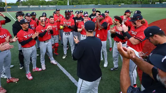 YSU baseball players and coaches celebrate following a victory at Wright State on May 15, 2026 (Photo by Bryson Chavez)