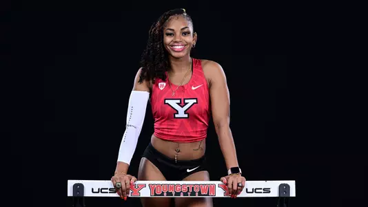 Madison Murry poses with a hurdle at 2026 Track and Field Media Day