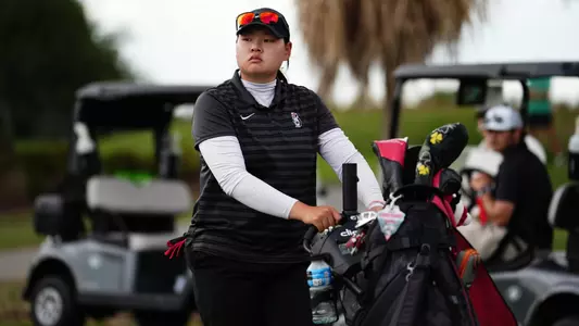 Neeranuch Prajunpanich walks to a tee box for YSU during the 2026 Horizon League Women's Golf Championship (Photo by Drae Smith)
