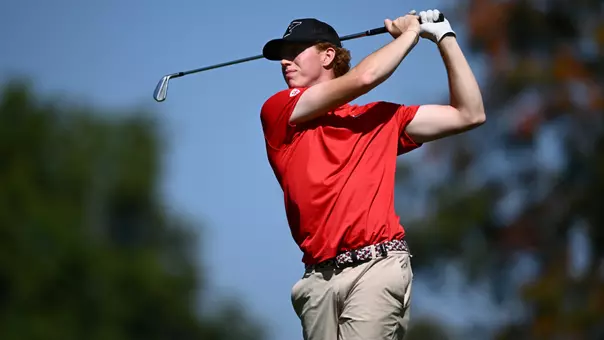 Ayden Richmond watches a tee shot for YSU during the Mercyhurst Laker Fall Invitational on Sept. 14-15, 2026 (Photo by Robert Hayes)