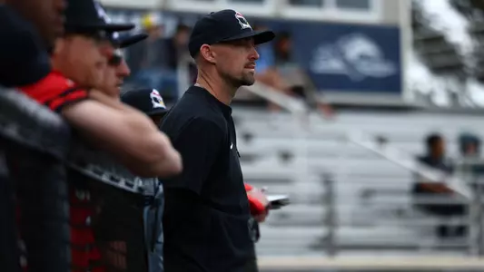 YSU Head Baseball Coach Trevor Charpie watches during a game at Longwood on March 1, 2026 (Photo by Bryson Chavez)