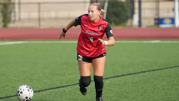 Sophomore Rylee Sorrell moves the ball up the field in the Red-White Soccer Game