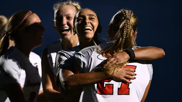 Ghita Haouzi celebreats the game-tying goal against Duquesne with her teammates
