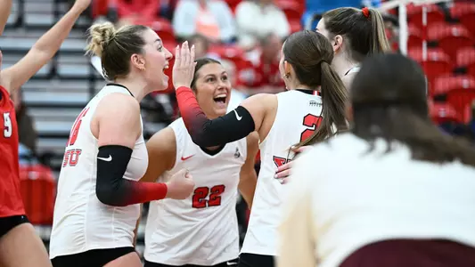 YSU's volleyball team celebrates a point in its 3-1 victory over Kent State on Sept. 18, 2026.