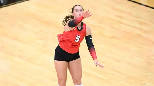 Journey Nicola serves in YSU's exhibition match against Findlay