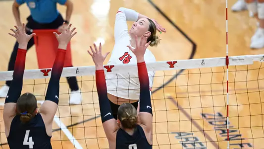 Kylie Surratt jumps for an attack in YSU's match against Duquesne.