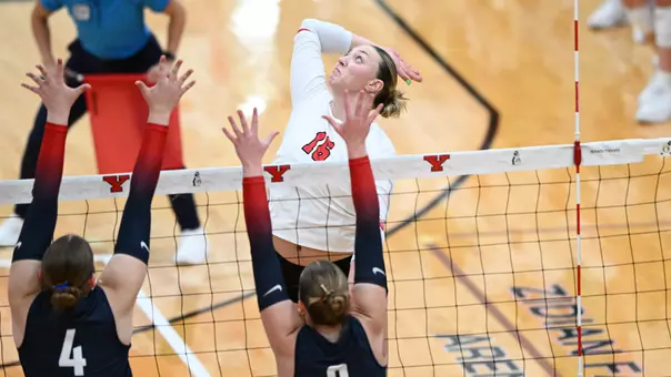 Kylie Surratt jumps for an attack in YSU's match against Duquesne.